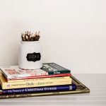 Language Books - white ceramic pencil organizer on top of stack of books