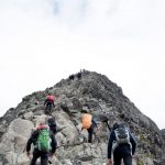 Leadership Development - climbers hiking through mountain peak during daytime