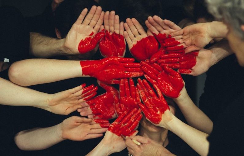 Empathy Heart - hands formed together with red heart paint